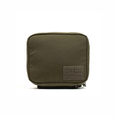 The GR2 Field Pocket by GORUCK, crafted from durable 1000D Cordura in a square, olive green design, features a zippered closure and a small rectangular patch on the front, making it perfect as an electronics organizer.