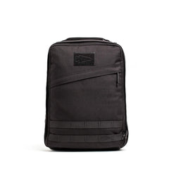 Black durable GORUCK rucksack with diagonal zipper pocket and reinforced stitching on white background