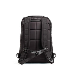 Back view of a black GORUCK rucksack with padded straps and chest buckle on white background