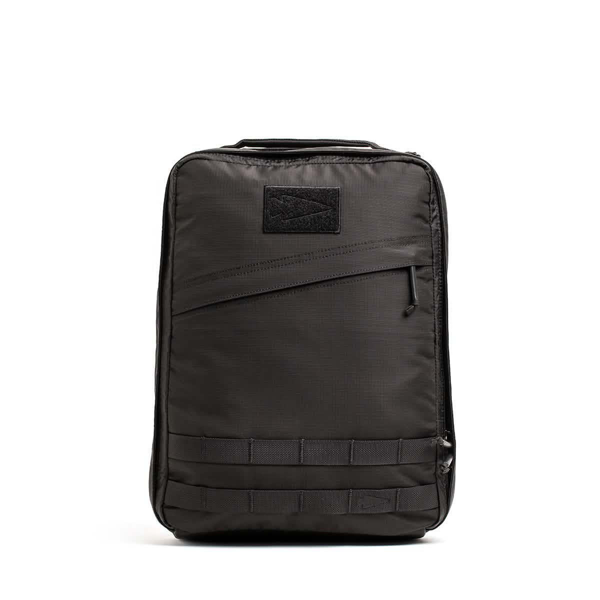 The GR0 - Ripstop ROBIC® is a black, rectangular, water-resistant backpack featuring a front zipper pocket and horizontal loops near the bottom—ideal for minimalist everyday carry.