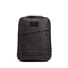 The GR0 - Ripstop ROBIC® is a black, rectangular, water-resistant backpack featuring a front zipper pocket and horizontal loops near the bottom—ideal for minimalist everyday carry.