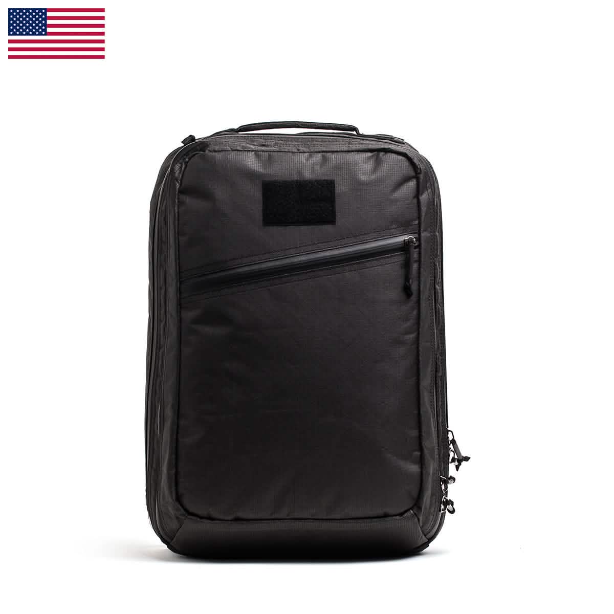 A GR2 USA x Carryology - Ultra Black backpack with a front zipper pocket, made from durable UHMWPE fabric, shown on a white background with a small US flag in the corner.