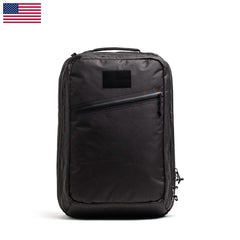 A GR2 USA x Carryology - Ultra Black backpack with a front zipper pocket, made from durable UHMWPE fabric, shown on a white background with a small US flag in the corner.