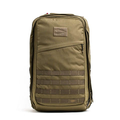 Introducing the GORUCK GR2 - Cordura, a tactical backpack in khaki inspired by Special Forces gear. This durable and functional pack features multiple compartments and MOLLE webbing on the front, along with a small patch area near the top and secure zippers for closure.