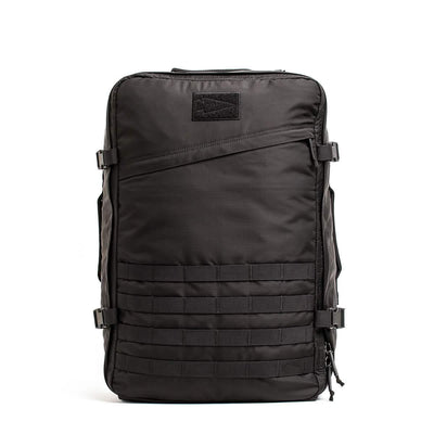 The GR3 - Ripstop ROBIC® by GORUCK, made from sturdy Robic nylon, boasts side buckle straps and a front grid pattern. With a top handle and dependable zippers, this carry-on rucksack is engineered for exceptional durability and functionality.