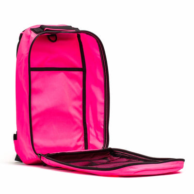The GORUCK Bullet Ruck Laptop - 14L backpack, in a vibrant pink color, showcases a sleek and modern design. It comes with an ultra-durable laptop compartment and a roomy main section. Inside, there are convenient interior pockets and a mesh area on the flap, all highlighted by elegant black zippers for an extra touch of style.