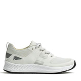 Introducing the GORUCK Men's Rough Runner in Light Grey and Dark Grey: This athletic shoe boasts a sleek, performance-enhancing design with gradient density. It features light gray accents on the heel adorned with an arrow-like graphic, while the textured white midsole seamlessly pairs with a black outer sole. Gray laces are threaded through ingeniously designed channels for added style and functionality.