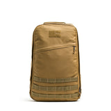 The GR1 is a tan tactical backpack with a front zipper pocket, top handle, bombproof laptop compartment, and MOLLE webbing at the bottom—modeled after the rucksack used by Special Forces.