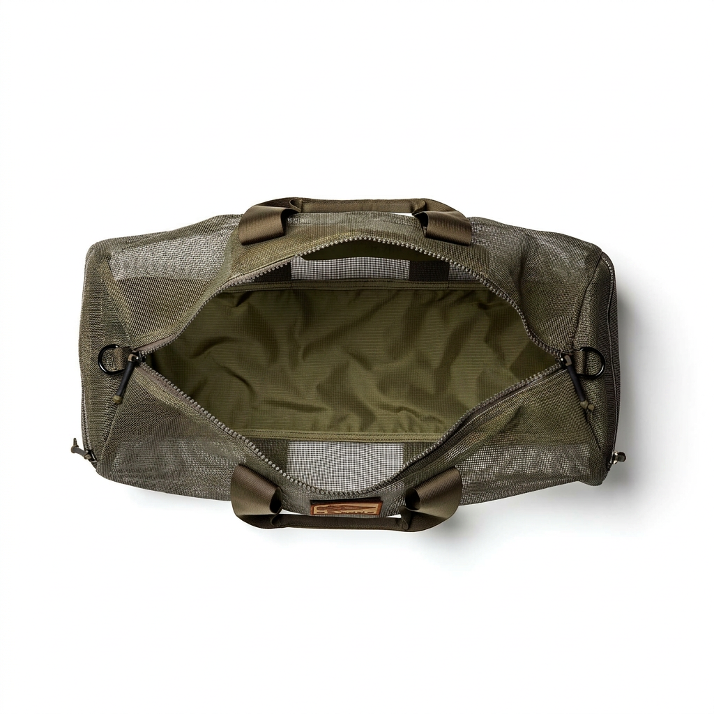 The Mesh Duffel Bag in olive green features a top zipper and spacious interior, ideal for storing dirty shoes or wet gear. Photographed from above with the bag open to display its roomy, functional design.