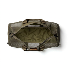 The Mesh Duffel Bag in olive green features a top zipper and spacious interior, ideal for storing dirty shoes or wet gear. Photographed from above with the bag open to display its roomy, functional design.