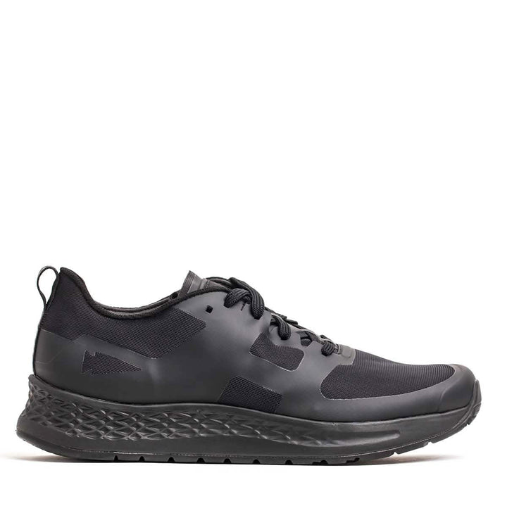 Introducing the Men's Rough Runner - Blackout by GORUCK: a sleek athletic shoe crafted for Rough Runner events. It features a textured sole, a lace-up design, and is made from smooth, matte material with subtle side detailing. The shoe also includes a convenient pull tab at the heel, perfectly capturing the essence of lightweight running shoes.