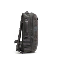 Side view of the dark gray Rucker 5.0, featuring padded straps and webbing loops for rucking, shown against a white background.