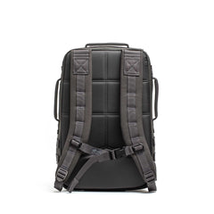 The Rucker 5.0 is shown in black from the back, highlighting its padded straps and sternum buckle.