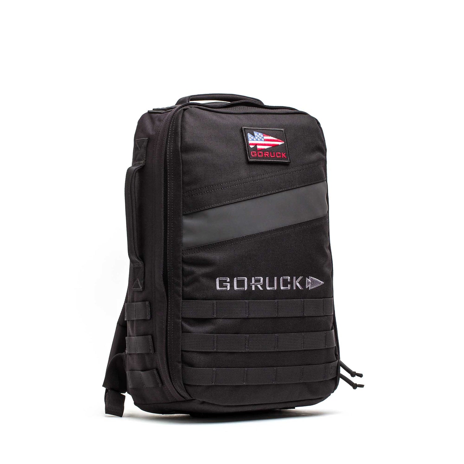The Rucker 5.0, a black GORUCK rucksack featuring an American flag patch, MOLLE webbing, and space for ruck plates, stands upright on a white background—ideal for your next rucking challenge.