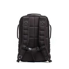 The Rucker 5.0, shown from the back, features padded shoulder straps and a padded back panel—a durable black rucksack ideal for rucking enthusiasts.