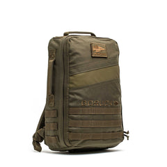The Rucker 5.0 is an olive green tactical rucksack featuring MOLLE webbing and a front GORUCK logo patch—ideal for your next rucking adventure.