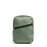 The KR1 2.0 - Kid Ruck features a light green, durable design with a front diagonal zipper pocket, side pockets, and top handle. Indestructible and perfect for every adventure—add patches to make it yours! Shown against a white background.