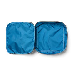 The open gray and blue Shadow Pocket by GORUCK, made from robust Ripstop ROBIC® Nylon, reveals its spacious interior, perfectly crafted to enhance the organization of your rucksack. Designed for seamless integration with other Shadow Pockets.