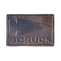 GORUCK brown leather patch with embossed arrowhead logo and stitched edges