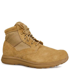 Introducing the GORUCK MACV-1, a mid-top boot in coyote suede leather, designed for durability and rugged terrains. This boot features a spacious toe box, padded ankle support, and metal eyelets for securing the laces. Its robust rubber sole is equipped with an all-terrain outsole to handle any challenging environment.