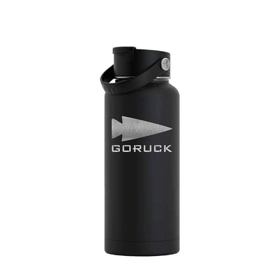 The GORUCK x RTIC water bottle by GORUCK features a sleek black stainless steel design with a silver logo and the word "GORUCK" engraved on its surface. It boasts a double-wall insulated construction to maintain beverage temperature, and comes equipped with a screw-on lid and handle for easy portability.