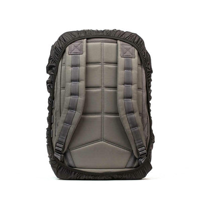 The GORUCK Ruck Rain Cover, a gray backpack equipped with padded shoulder straps, features a sleek black rain cover and is displayed from the back. Its durable fabric and minimalist design make it a versatile accessory for any weather conditions.