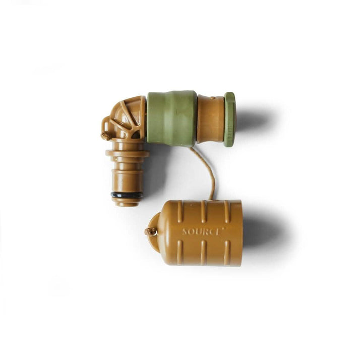 Introducing the Hydration Valve Mouthpiece by GORUCK: This compact, L-shaped component is designed with a military aesthetic and constructed from durable green and tan plastic parts. The left portion features a grooved cylindrical shape, linked by a short tube to a larger tan barrel-shaped section emblazoned with the word "SOURCE." Ideal as a replacement mouthpiece for your hydration bladder.