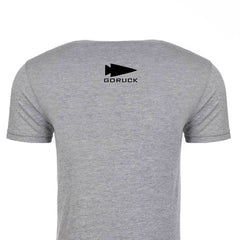 Rear view of the GORUCK USA Tee - Tri-blend by vendor-unknown, showcasing a black spearhead design near the collar on its premium gray tri-blend fabric.
