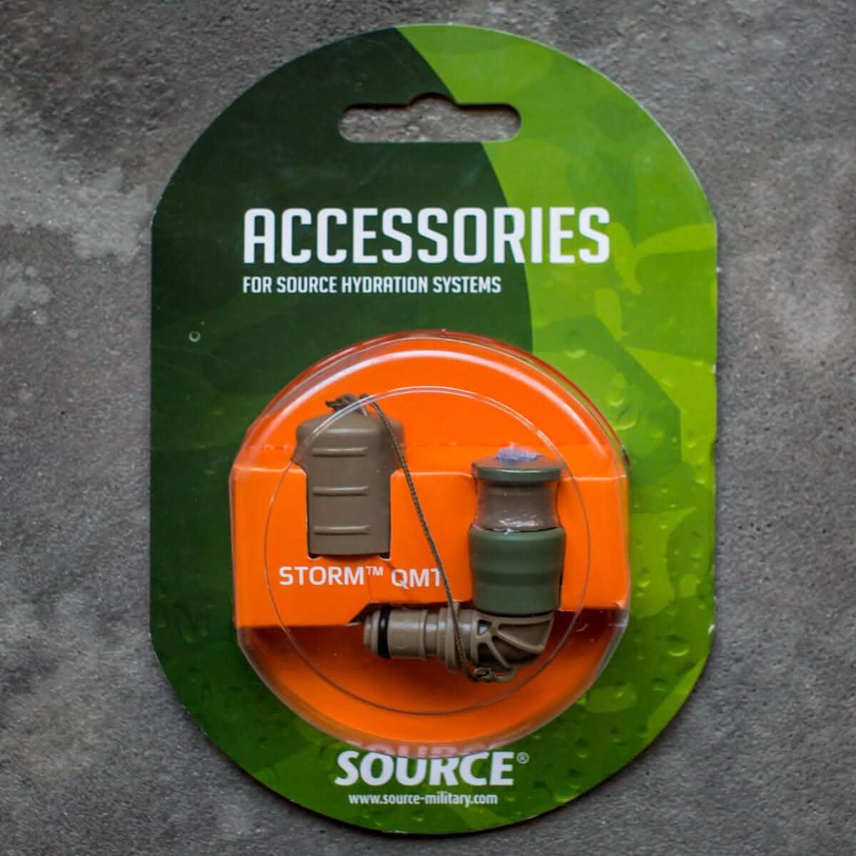 The packaging for the GORUCK Hydration Valve Mouthpiece showcases a sleek design with green and gray colors, set against a vibrant green and orange background. This essential accessory ensures you're always ready for any adventure with your GORUCK hydration system.