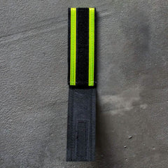 GORUCK reflective Ruck Bands with black Velcro and bright yellow safety stripes on concrete background