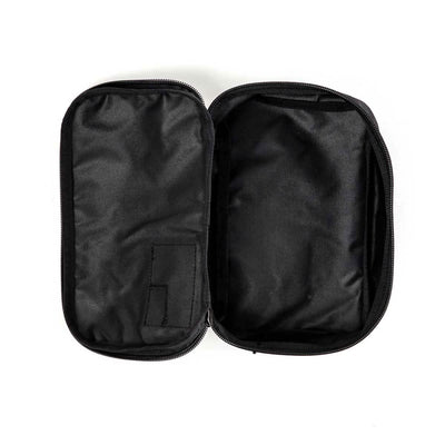 The GORUCK Shadow Pockets pouch, constructed from durable Cordura, comes in black with a zipper closure and two main compartments set against a white background. On the left side, it includes a small fabric pocket designed for efficient ruck organization, while the larger compartment on the right remains empty.