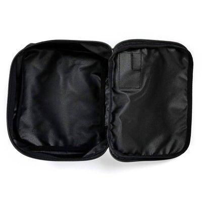 A black pouch by GORUCK, featuring a sleek Cordura exterior, opens to showcase its well-designed compartments. The smooth, shiny fabric includes the brand's signature Shadow Pockets, with a small pocket on one side and a loop above it for easy ruck organization.