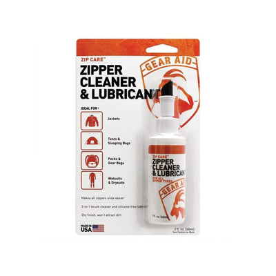 Picture of the Gear Aid Zip Care - Zipper Cleaner & Lubricant. Ideal for GORUCK Events, its packaging emphasizes its suitability for jackets, tents, sleeping bags, gear bags, and wetsuits. It features a 2 fl. oz bottle equipped with a brush applicator and creates a protective film; proudly manufactured in the USA.