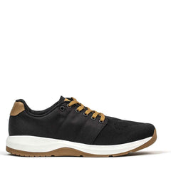 The Men's Ballistic Trainers - Black + White + Coyote by GORUCK are designed for both casual and athletic wear. These shoes feature a black finish with a white sole and tan accents, including tan laces, a tan heel tab, and a brown outsole. The breathable engineered warp knit upper material enhances their versatility as functional fitness footwear.