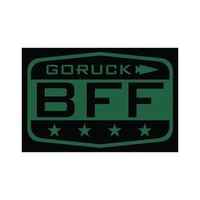 The Patch - BFF Test by vendor-unknown is a badge-like design showcasing a dark green and black rectangular logo with the text GORUCK BFF. An arrow pointing to the right sits above "BFF," while four stars are aligned below, reflecting GORUCK's spirit and supporting your Baseline Functional Fitness Test goals.