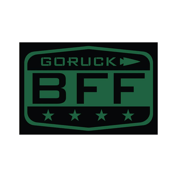 The Patch - BFF Test by vendor-unknown is a badge-like design showcasing a dark green and black rectangular logo with the text GORUCK BFF. An arrow pointing to the right sits above "BFF," while four stars are aligned below, reflecting GORUCK's spirit and supporting your Baseline Functional Fitness Test goals.