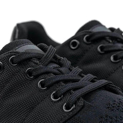 Close-up of black GORUCK rucking shoes with durable textured fabric and black laces