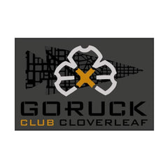 GORUCK Club Cloverleaf logo featuring a stylized cloverleaf and arrow design in gold, black, and gray