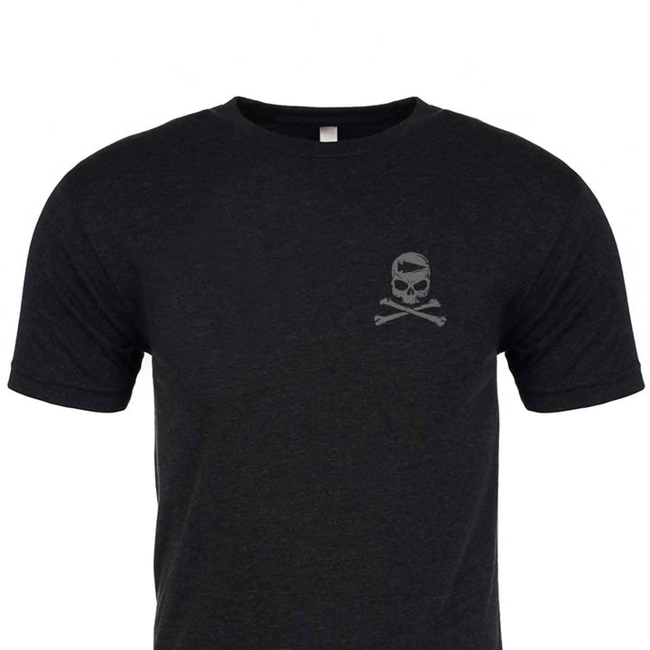 The GORUCK Tribe Tee - Tri-Blend in black, by vendor-unknown, boasts a subtle skull and crossbones design on the upper left chest, ideal for those who embody the spirit of the GORUCK Challenge.