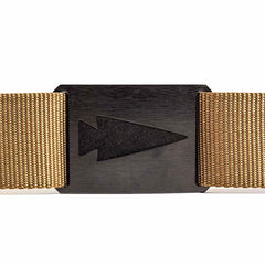 Close-up of a black metal arrowhead belt buckle on a tan woven tactical belt