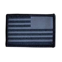 Reflective reverse American flag patch with black and gray stripes and border for tactical gear