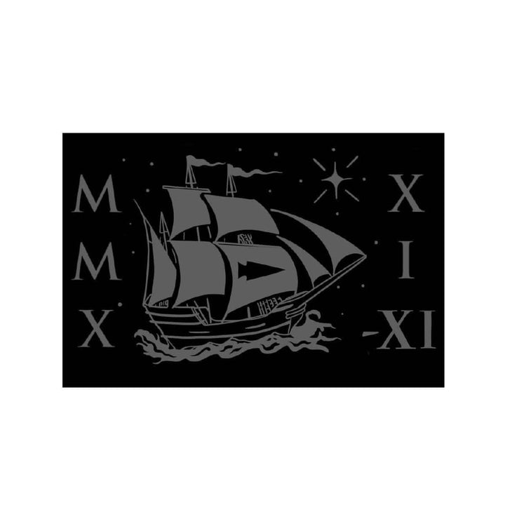 Illustration of a sailing ship with large sails set against a black background, surrounded by Roman numerals and stars, capturing the adventurous spirit of the GORUCK Tribe 2021 Patch by GORUCK.